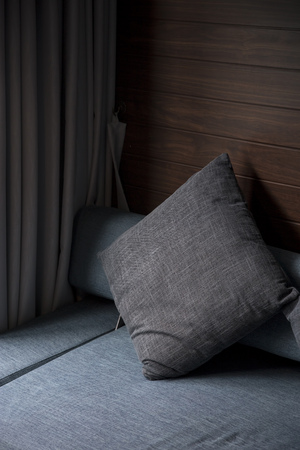 Pillow with part of sofa in living roomの写真素材