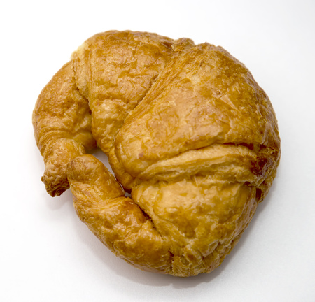 Freshly baked croissant isolated on white backgroundの写真素材