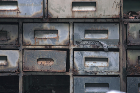 Old assortment metal boxes with dirty textureの写真素材