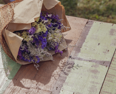 Dry flower bouquet on the wooden tableの写真素材