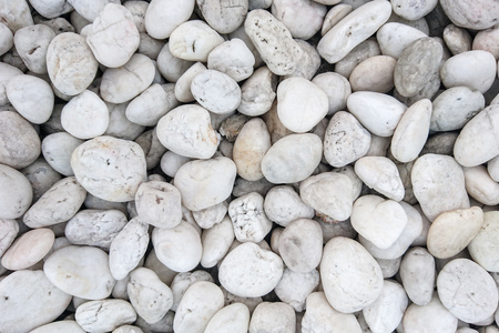 Pile of white pebble stones for backgroundの写真素材