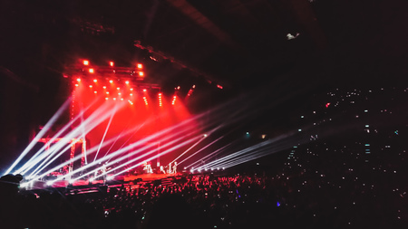 Abstract blur of stage and bright beautiful rays of light