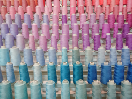 Colorful thread spool decoration of wall backgroundの写真素材