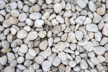 Pile of white pebble stones for backgroundの写真素材