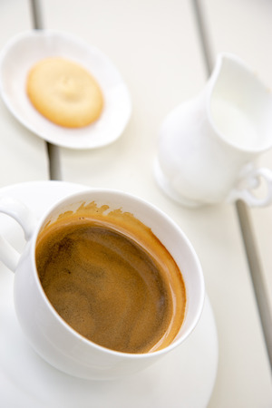 Cup of espresso coffee on white tableの写真素材