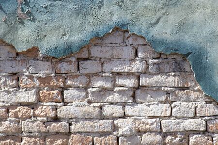 Brick wall with cement cracked for backgroundの写真素材