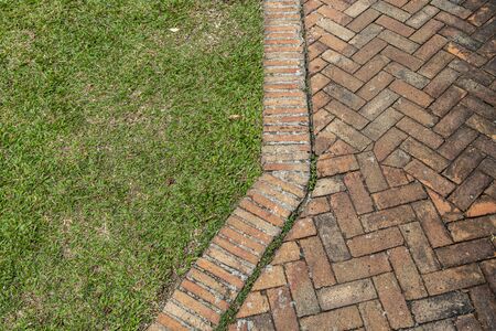 Stone pathway with grass in the gardenの写真素材
