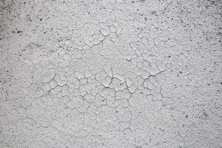 Dried cracked clay texture and gravel stones