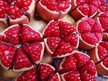 Pomegranate cut of half show for sale in marketの写真素材