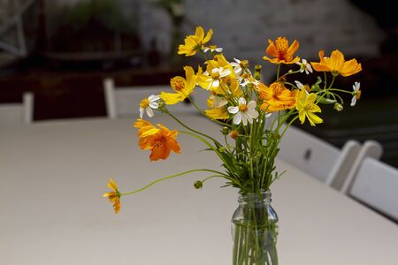 Bouquet flower in jar on the tableの写真素材