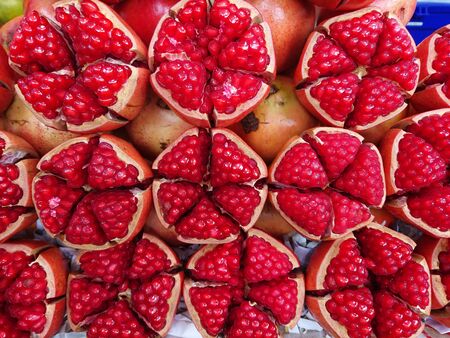 Pomegranate cut of half show for sale in marketの写真素材