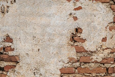 Brick wall with cement cracked for backgroundの写真素材