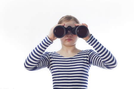 girl sailor in the shirt looks in binocularsの写真素材