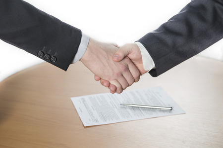 the handshake,the two men shake handsの写真素材