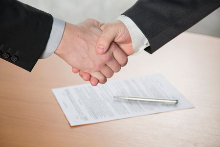 the handshake,the two men shake handsの写真素材