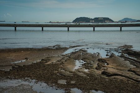 Bridge around the old town of Panama with rocks and birds at low tideの写真素材