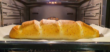 Freshly baked homemade bread still in the oven. Hot, fresh, tasty, fragrant with a crispy crust
