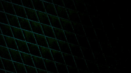 Dark abstract background featuring a green and black grid pattern with a grainy texture. Perfect for...