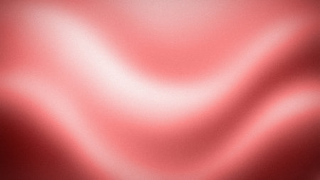 Red silk fabric texture background with some smooth folds and highlights in itの写真素材