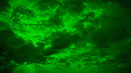 Green sky with clouds and sunbeams. Nature abstract background.の写真素材
