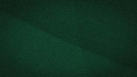 A deep and mysterious abstract background with a subtle diagonal gradient in dark green tones, featuring a fine, grainy texture, perfect for designsの写真素材