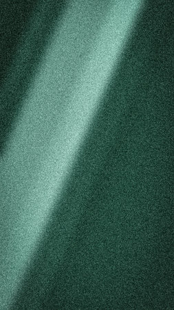 Abstract gradient background in deep teal and turquoise hues, featuring a bright, diagonal light beam. High-quality grainy noise texture ideal for modern and corporate design projectsの写真素材