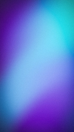 Abstract vertical background with a grainy texture featuring a vibrant gradient blend of purple, violet, cyan, and light blue for modern, creative digital designsの写真素材