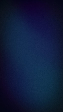Abstract vertical background with a dark blue and indigo grainy texture, featuring a smooth gradient with subtle light leaks for an elegant, modern aestheticの写真素材