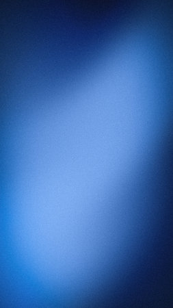 Vertical abstract background with a deep navy and royal blue grainy texture, featuring a smooth...