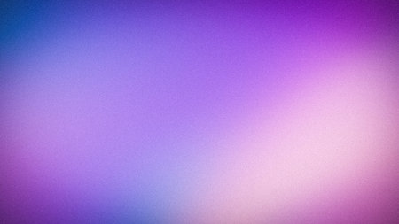 Abstract 4K grainy gradient background featuring soft blue, purple, and pale pink tones. Blurred...