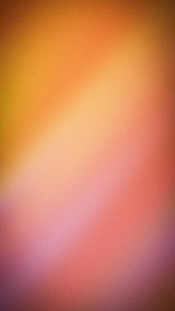 Abstract vertical grainy gradient background with warm orange, yellow, pink, and purple tones. Perfect blurred texture for modern wallpapers, banners, and artの写真素材