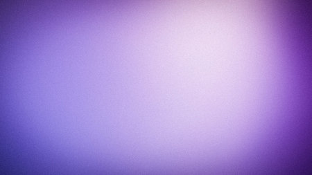 Vibrant violet and lavender grainy abstract gradient background with bright light area