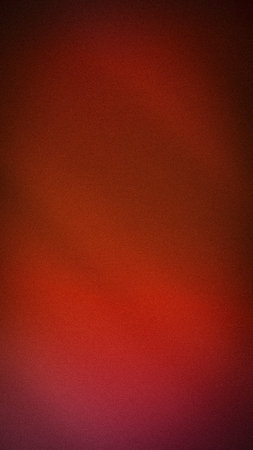 Abstract grainy red and maroon vertical gradient background with dark vignette aesthetic