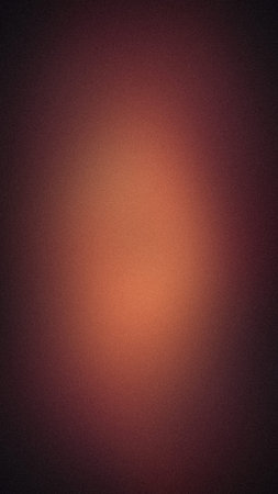 Grainy abstract vertical background with dark burgundy and warm peach glowing gradient