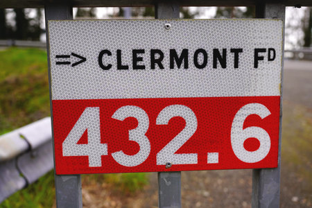 Road distance marker to Clermont-Ferrand on a highway in France, March 17, 2026