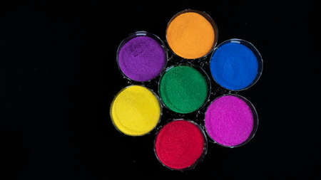 Round Of Seven Colors in Glass With Top View Isolated in Black Backgroundの写真素材