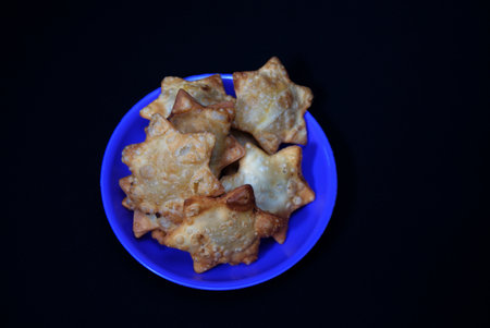 A blue plate with Aloo Puff Pastry.
