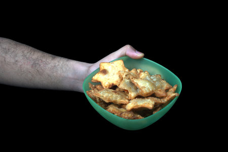 Golden Star-Shaped Aloo Puff Pastry Served with Zesty Tomato Sauce in Hand - A Perfect Blend of Flavors for Parties and Afternoon Teaの写真素材