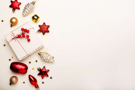 Christmas composition. Christmas toys, gift and sparkles on a white background. Flat lay, top view, copy spaceの写真素材