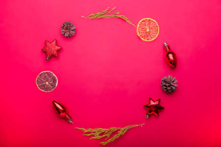 Christmas toys frame on a red background. Copy spaceの写真素材
