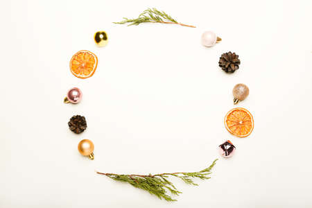 Christmas composition. Fir tree branches, gold and pink decorations on white background.の写真素材