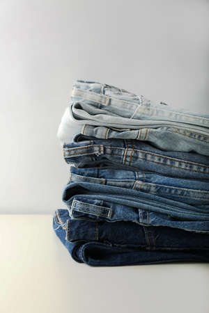 stack of blue jeans on white background. Jeans collectionの写真素材