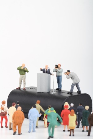 miniature figurines of a politician speaking to the people during an election rallyの写真素材