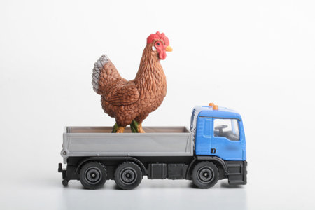 Truck with a chicken on a white background. Toy for children.の写真素材