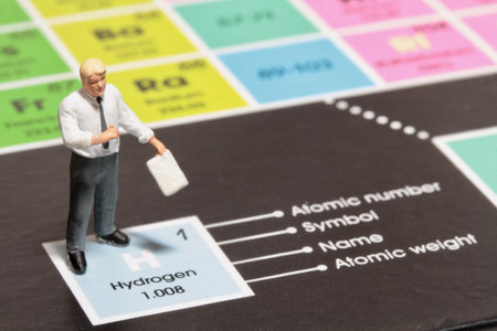 Miniature people : Businessman standing on business chart with information.