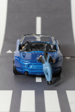 miniature people on the road, concept of car accident or traffic accidentの写真素材