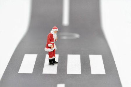 Miniature people : Santa Claus standing on the road with crosswalkの写真素材