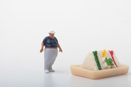 Miniature people : chef standing with bread and cheese on white backgroundの写真素材