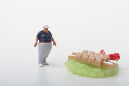 Miniature people : fat man standing on meat dish on white background