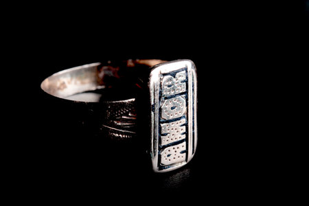 Silver ring on a black background. Jewelry and luxury concept.の写真素材